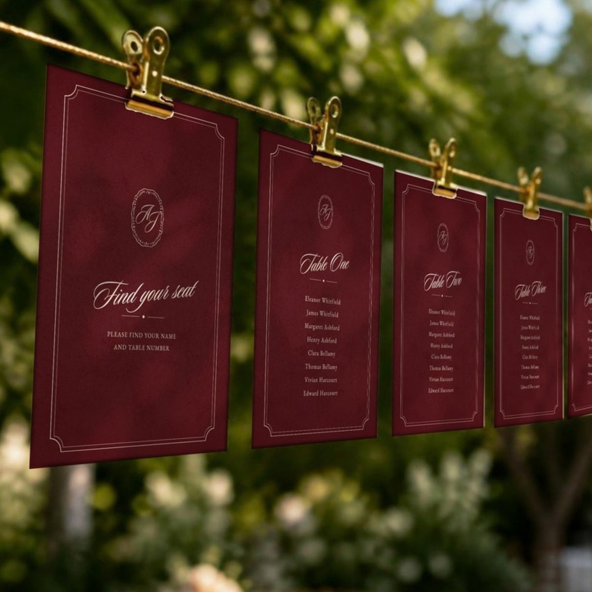 Find your seat card and table cards hanging from a line with gold clips